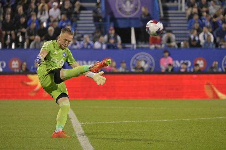 Aug 26, 2023; Montreal, Quebec, CAN; CF Montreal goalkeeper Jonathan Sirois (40) punts the ball against the New England Revolution during the second half at Stade Saputo. Mandatory Credit: Eric Bolte-USA TODAY Sports