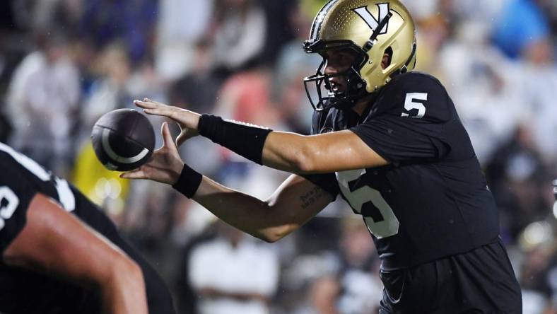 Aug 26, 2023; Nashville, Tennessee, USA; Vanderbilt Commodores quarterback AJ Swann (5) takes the snap during the first half against the Hawaii Warriors at FirstBank Stadium. Mandatory Credit: Christopher Hanewinckel-USA TODAY Sports