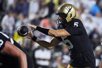 Aug 26, 2023; Nashville, Tennessee, USA; Vanderbilt Commodores quarterback AJ Swann (5) takes the snap during the first half against the Hawaii Warriors at FirstBank Stadium. Mandatory Credit: Christopher Hanewinckel-USA TODAY Sports