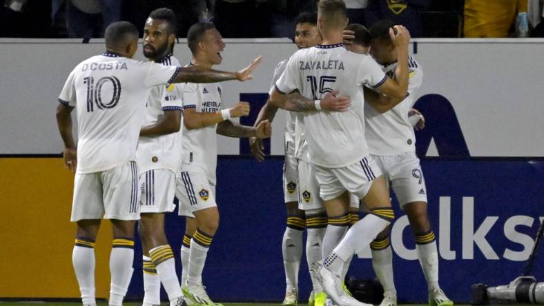 Aug 26, 2023; Carson, California, USA;  Los Angeles Galaxy players celebrate after a goal by midfielder Tyler Boyd (11) in the first half against the Chicago Fire at Dignity Health Sports Park. Mandatory Credit: Jayne Kamin-Oncea-USA TODAY Sports