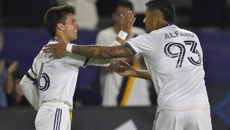 Aug 26, 2023; Carson, California, USA; Los Angeles Galaxy midfielder Riqui Puig (6) is congratulated by defender Tony Alfaro (93) after he scored a goal in the second half against the Chicago Fire at Dignity Health Sports Park. Mandatory Credit: Jayne Kamin-Oncea-USA TODAY Sports