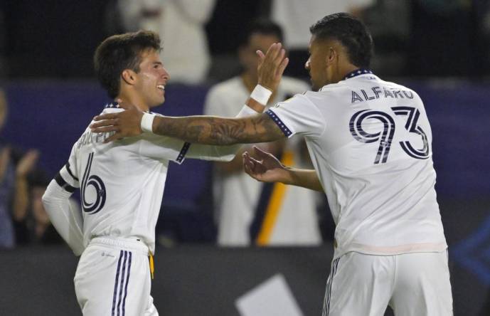Aug 26, 2023; Carson, California, USA; Los Angeles Galaxy midfielder Riqui Puig (6) is congratulated by defender Tony Alfaro (93) after he scored a goal in the second half against the Chicago Fire at Dignity Health Sports Park. Mandatory Credit: Jayne Kamin-Oncea-USA TODAY Sports