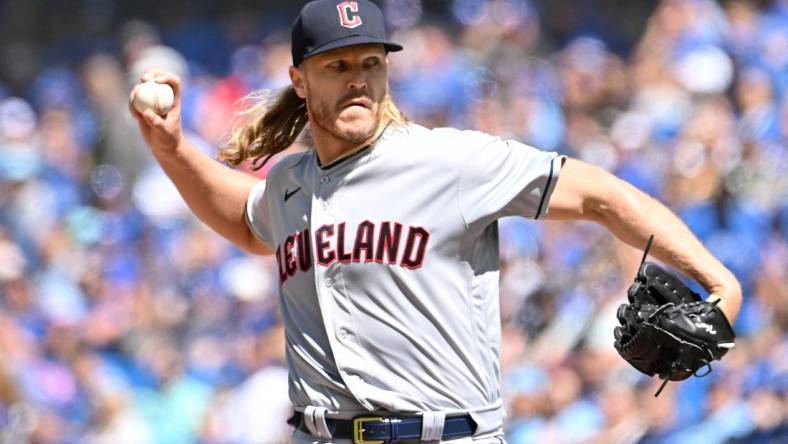 Aug 27, 2023; Toronto, Ontario, CAN;  Cleveland Guardians starting pitcher Noah Syndergaard (34) delivers a pitch against the Toronto Blue Jays in the first inning at Rogers Centre. Mandatory Credit: Dan Hamilton-USA TODAY Sports