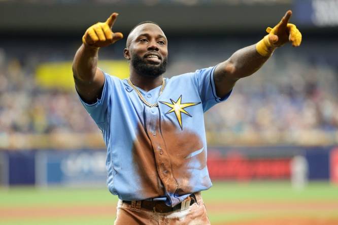 Aug 27, 2023; St. Petersburg, Florida, USA;  Tampa Bay Rays left fielder Randy Arozarena (56) reacts after scoring a run against the New York Yankees in the first inning at Tropicana Field. Mandatory Credit: Nathan Ray Seebeck-USA TODAY Sports