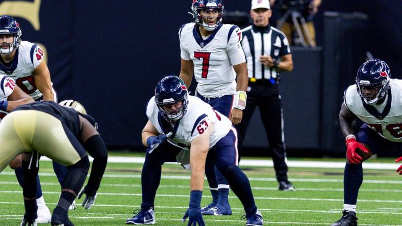 Aug 27, 2023; New Orleans, Louisiana, USA; Houston Texans quarterback C.J. Stroud (7) looks over the New Orleans Saints defensive line  during the first half at the Caesars Superdome. Mandatory Credit: Stephen Lew-USA TODAY Sports