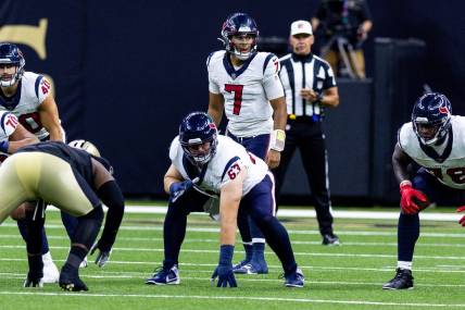 Aug 27, 2023; New Orleans, Louisiana, USA; Houston Texans quarterback C.J. Stroud (7) looks over the New Orleans Saints defensive line  during the first half at the Caesars Superdome. Mandatory Credit: Stephen Lew-USA TODAY Sports
