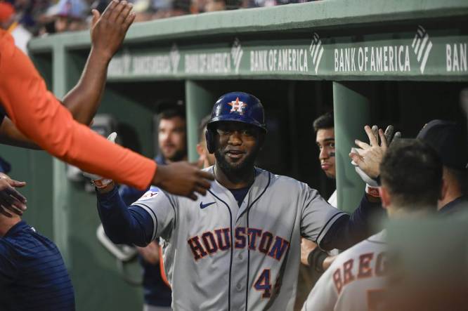Aug 29, 2023; Boston, Massachusetts, USA;  Houston Astros designated hitter Yordan Alvarez (44) is congratulated in the dugout after hitting a home run during the first inning against the Boston Red Sox at Fenway Park. Mandatory Credit: Bob DeChiara-USA TODAY Sports