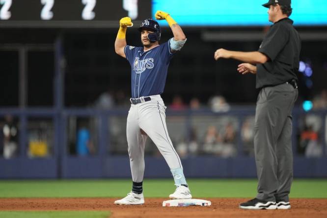 Aug 29, 2023; Miami, Florida, USA;  Tampa Bay Rays third baseman Isaac Paredes (17) celebrates a two-RBI double in the sixth inning against the Miami Marlins at loanDepot Park. Mandatory Credit: Jim Rassol-USA TODAY Sports