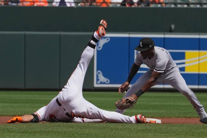 Aug 30, 2023; Baltimore, Maryland, USA; Baltimore Orioles outfielder Anthony Santander (25) slides in safely after connecting on a run scoring double in the first inning against the Chicago White Sox at Oriole Park at Camden Yards. Mandatory Credit: Mitch Stringer-USA TODAY Sports