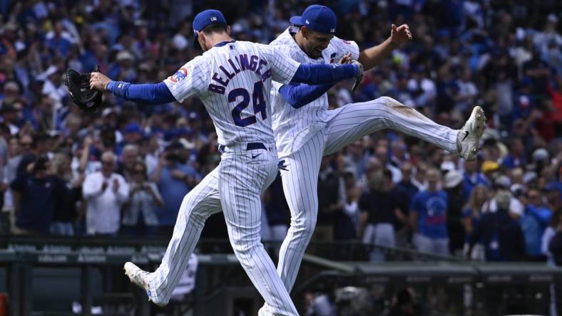 Aug 30, 2023; Chicago, Illinois, USA; Chicago Cubs center fielder Cody Bellinger (24) and second baseman Christopher Morel (5) celebrate  after beating the Milwaukee Brewers at Wrigley Field. Mandatory Credit: Matt Marton-USA TODAY Sports