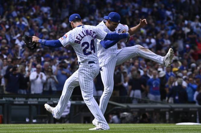 Aug 30, 2023; Chicago, Illinois, USA; Chicago Cubs center fielder Cody Bellinger (24) and second baseman Christopher Morel (5) celebrate  after beating the Milwaukee Brewers at Wrigley Field. Mandatory Credit: Matt Marton-USA TODAY Sports