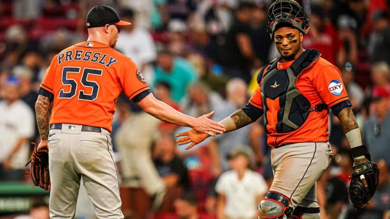 Aug 30, 2023; Boston, Massachusetts, USA; Houston Astros relief pitcher Ryan Pressly (55) and catcher Martin Maldonado (15) congratulate each other after defeating the Boston Red Sox at Fenway Park. Mandatory Credit: David Butler II-USA TODAY Sports