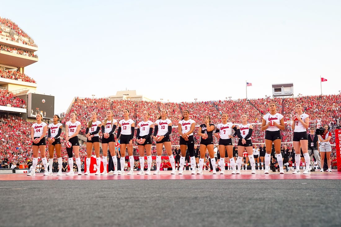 Aug 30, 2023; Lincoln, NE, USA; The Nebraska Cornhuskers watch a presentation before the match against the Omaha Mavericks at Memorial Stadium. Mandatory Credit: Dylan Widger-USA TODAY Sports