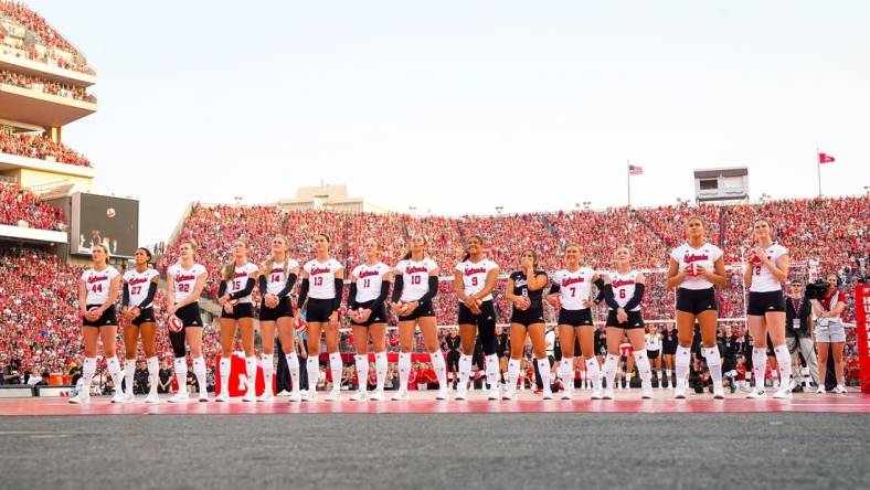 Aug 30, 2023; Lincoln, NE, USA; The Nebraska Cornhuskers watch a presentation before the match against the Omaha Mavericks at Memorial Stadium. Mandatory Credit: Dylan Widger-USA TODAY Sports