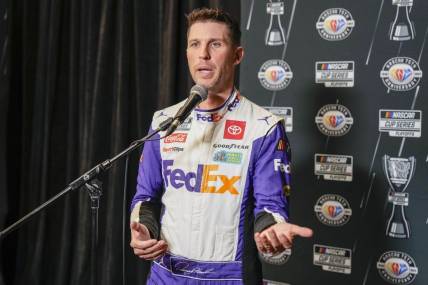 Aug 31, 2023; Charlotte, North Carolina, USA; Denny Hamlin answers questions from the media at Charlotte Convention Center. Mandatory Credit: Jim Dedmon-USA TODAY Sports