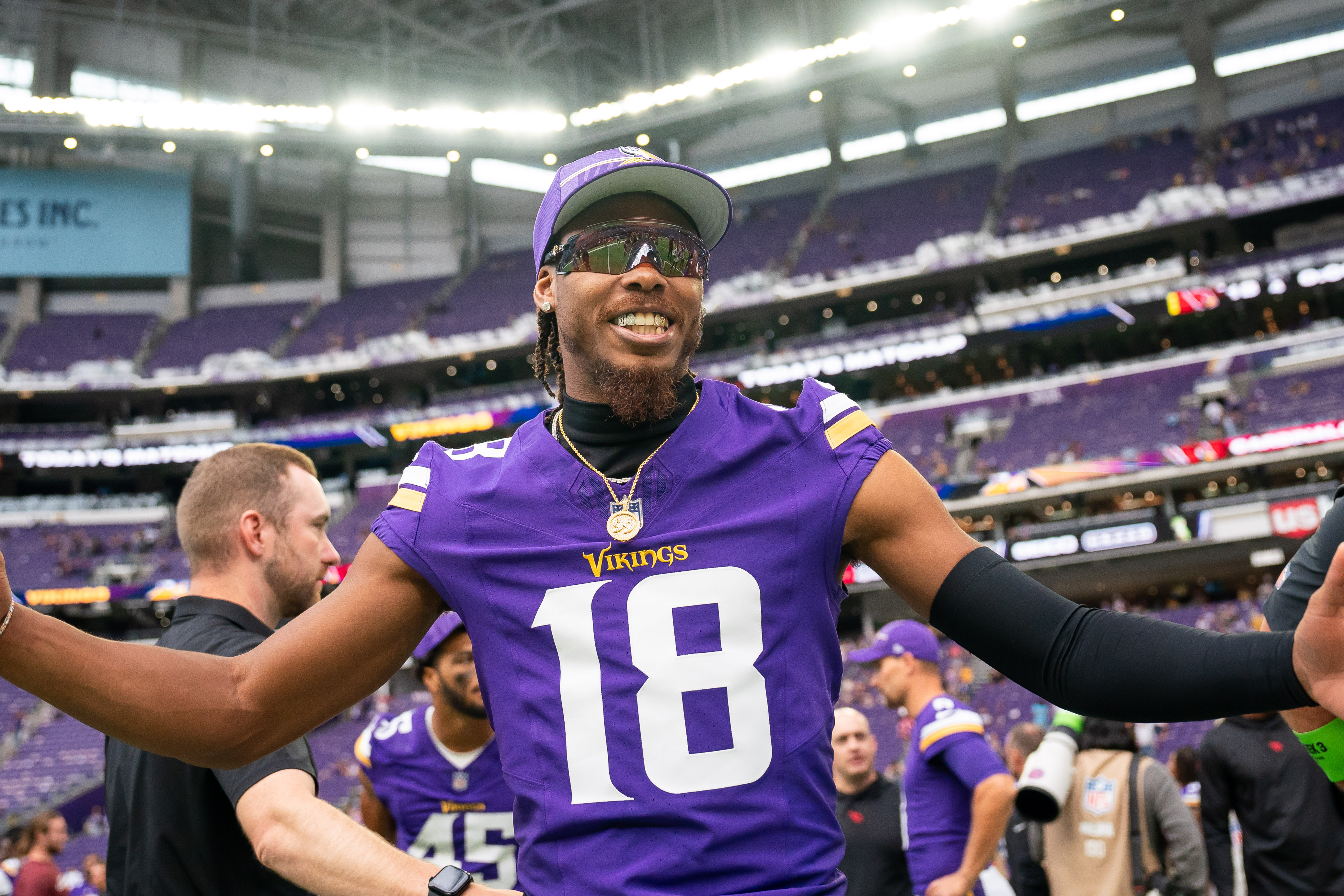 Minnesota Vikings wide receiver Justin Jefferson (18) talks with Arizona  Cardinals players after a NFL preseason