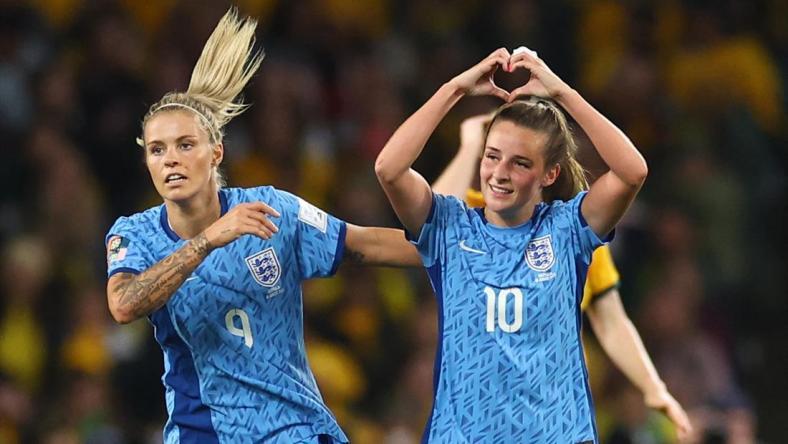 England's Ella Toone celebrates scoring their first goal with Rachel Daly.