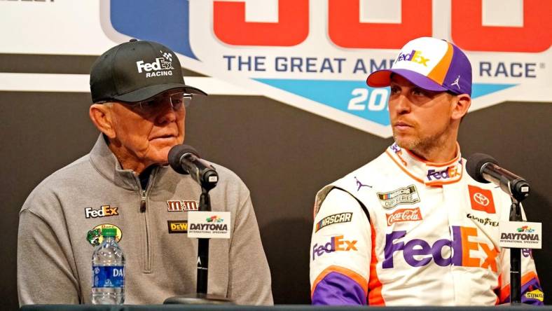 Feb 17, 2020; Daytona Beach, Florida, USA; NASCAR Cup Series driver Denny Hamlin (11) speaks to media with team owner Joe Gibbs (left) after the Daytona 500 at Daytona International Speedway. Mandatory Credit: John David Mercer-USA TODAY Sports