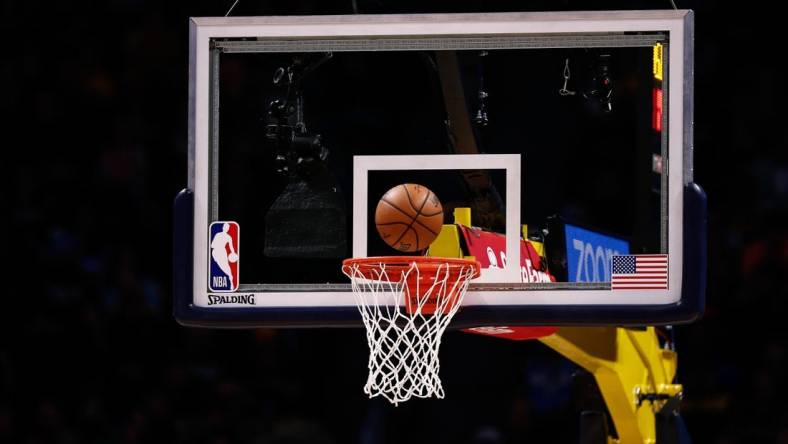 Dec 29, 2019; Denver, Colorado, USA; A general view of the NBA game ball being shot at the basket during a free throw attempt in the second quarter of the game between the Denver Nuggets and the Sacramento Kings at the Pepsi Center. Mandatory Credit: Isaiah J. Downing-USA TODAY Sports