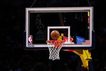 Dec 29, 2019; Denver, Colorado, USA; A general view of the NBA game ball being shot at the basket during a free throw attempt in the second quarter of the game between the Denver Nuggets and the Sacramento Kings at the Pepsi Center. Mandatory Credit: Isaiah J. Downing-USA TODAY Sports