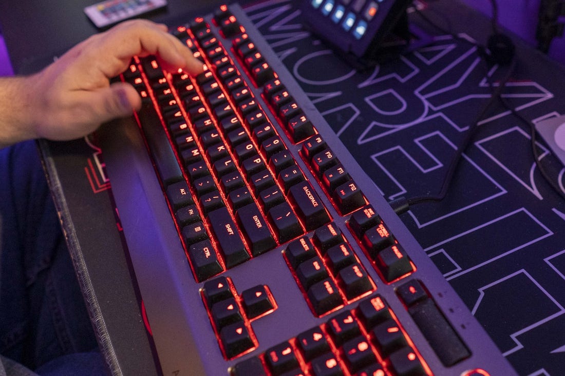 A backlit keyboard is part of the gear online video game streamer Jordan Woodruff uses in his Gilbert home.

Jordan Woodruff