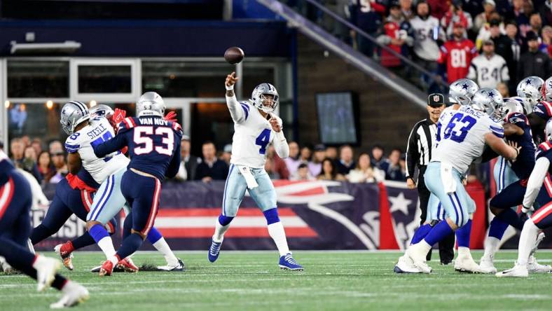 Oct 17, 2021; Foxborough, Massachusetts, USA; Dallas Cowboys quarterback Dak Prescott (4) throws the ball against the New England Patriots during the second half at Gillette Stadium. Mandatory Credit: Brian Fluharty-USA TODAY Sports