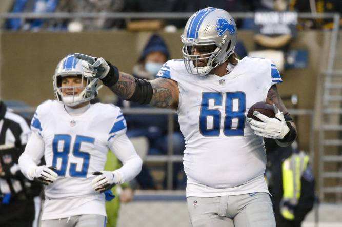 Jan 2, 2022; Seattle, Washington, USA; Detroit Lions offensive tackle Taylor Decker (68) celebrates after catching a touchdown pass against the Seattle Seahawks during the third quarter at Lumen Field. Mandatory Credit: Joe Nicholson-USA TODAY Sports