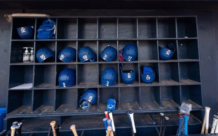Mar 19, 2022; Peoria, Arizona, USA; A general view of hats and bats belonging the the Los Angeles Dodgers before spring training game against the Seattle Mariners at Peoria Sports Complex. Mandatory Credit: Allan Henry-USA TODAY Sports