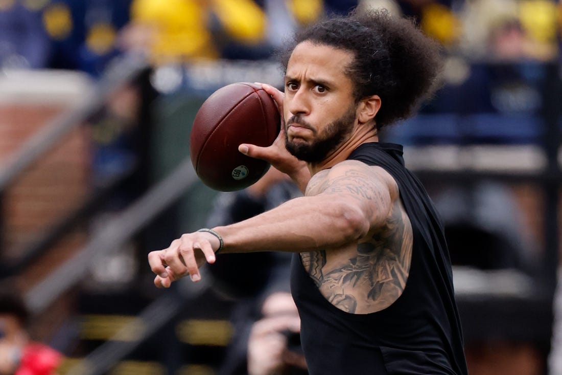 Apr 2, 2022; Ann Arbor, Michigan, USA;  Colin Kaepernick passes during halftime at the Michigan Spring game at Michigan Stadium. Mandatory Credit: Rick Osentoski-USA TODAY Sports