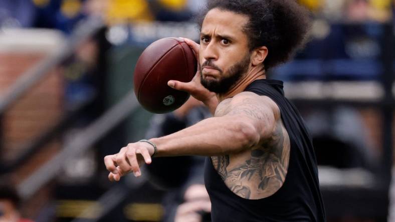 Apr 2, 2022; Ann Arbor, Michigan, USA;  Colin Kaepernick passes during halftime at the Michigan Spring game at Michigan Stadium. Mandatory Credit: Rick Osentoski-USA TODAY Sports