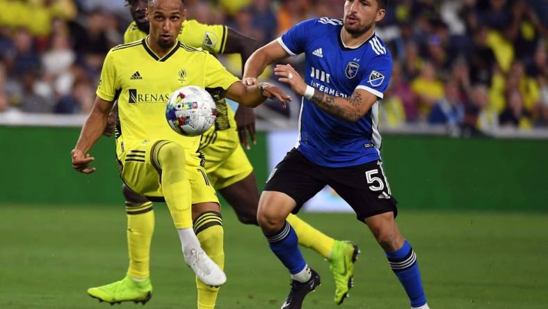 Jun 11, 2022; Nashville, Tennessee, USA; Nashville SC midfielder Hany Mukhtar (10) plays the ball into the box during the second half against the San Jose Earthquakes at Geodis Park. Mandatory Credit: Christopher Hanewinckel-USA TODAY Sports