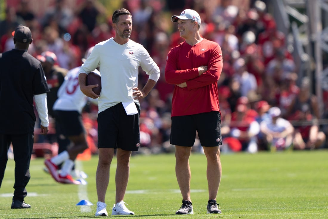 Jul 27, 2022; Santa Clara, CA, USA; San Francisco 49ers head coach Kyle Shanahan (left) and general manager John Lynch watches the players during Training Camp at the SAP Performance Facility near Levi Stadium. Mandatory Credit: Stan Szeto-USA TODAY Sports