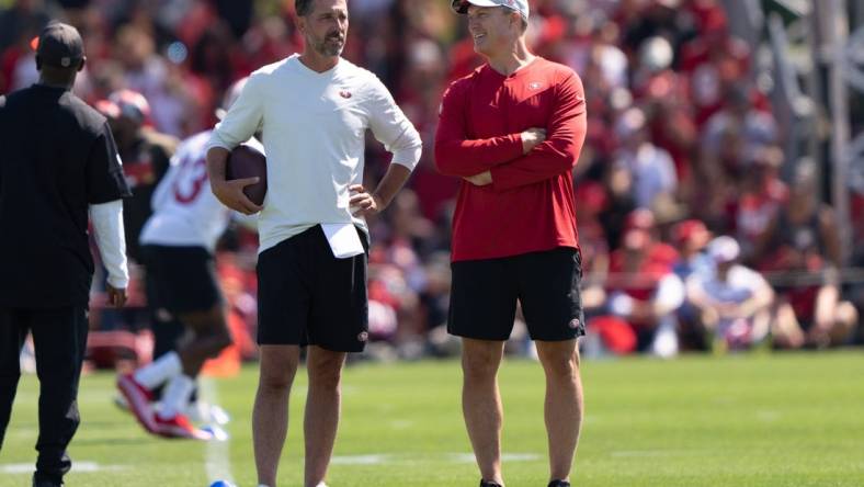 Jul 27, 2022; Santa Clara, CA, USA; San Francisco 49ers head coach Kyle Shanahan (left) and general manager John Lynch watches the players during Training Camp at the SAP Performance Facility near Levi Stadium. Mandatory Credit: Stan Szeto-USA TODAY Sports