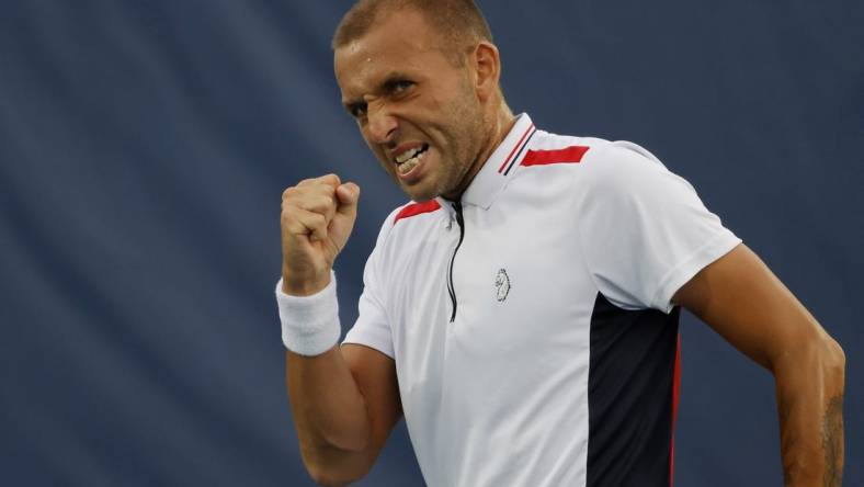 Aug 5, 2022; Washington, DC, USA; Daniel Evans (GBR) reacts after winning a point against Yoshihito Nishioka (JPN) (not pictured) on day five of the Citi Open at Rock Creek Park Tennis Center. Mandatory Credit: Geoff Burke-USA TODAY Sports