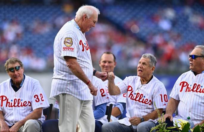 Aug 6, 2022; Philadelphia, Pennsylvania, USA; Former Phillies manager Charlie Manuel greets former Phillies manager Larry Bowa before the game between the Philadelphhia Phillies and Washington Nationals at Citizens Bank Park. Mandatory Credit: Kyle Ross-USA TODAY Sports