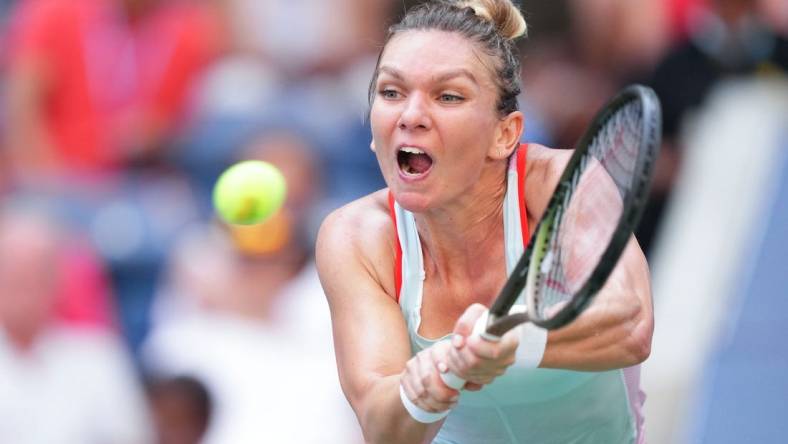 Aug 29, 2022; Flushing, NY, USA; Simona Halep of Romania hits to Daria Snigur of Ukraine on day one of the 2022 U.S. Open tennis tournament at USTA Billie Jean King National Tennis Center. Mandatory Credit: Danielle Parhizkaran-USA TODAY Sports