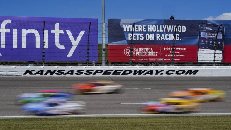 Sep 11, 2022; Kansas City, Kansas, USA; A general view of turn three as the field passes during the Hollywood Casino 400 at Kansas Speedway. Mandatory Credit: Jay Biggerstaff-USA TODAY Sports