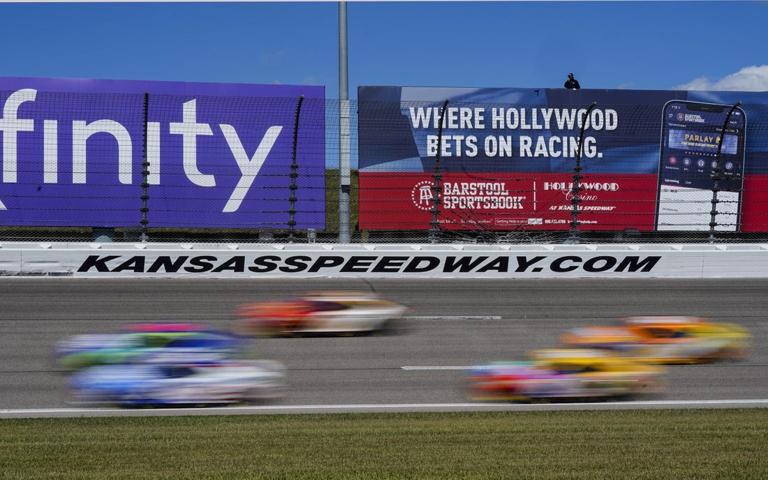 Sep 11, 2022; Kansas City, Kansas, USA; A general view of turn three as the field passes during the Hollywood Casino 400 at Kansas Speedway. Mandatory Credit: Jay Biggerstaff-USA TODAY Sports