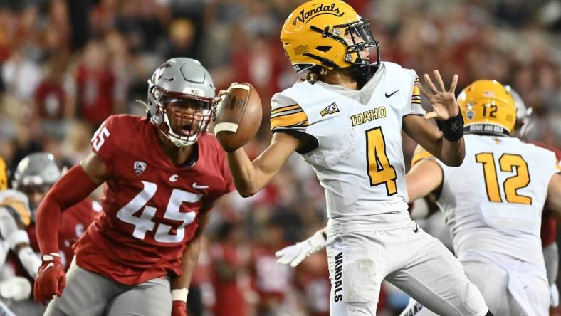 Sep 3, 2022; Pullman, Washington, USA; Idaho Vandals quarterback Gevani McCoy (4) throws the ball against Washington State Cougars defensive end Raam Stevenson (45) in the second half at Gesa Field at Martin Stadium. Mandatory Credit: James Snook-USA TODAY Sports