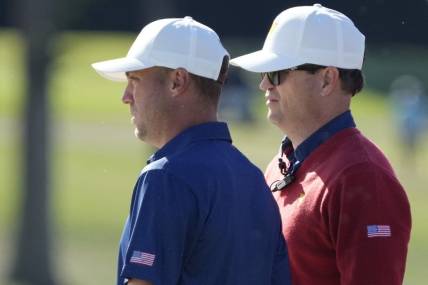 Team USA golfer Justin Thomas (left) and assistant captain Zach Johnson (right) talk on the 13th green during the foursomes match play of the Presidents Cup golf tournament at Quail Hollow Club (file photo). Mandatory Credit: Jim Dedmon-USA TODAY Sports