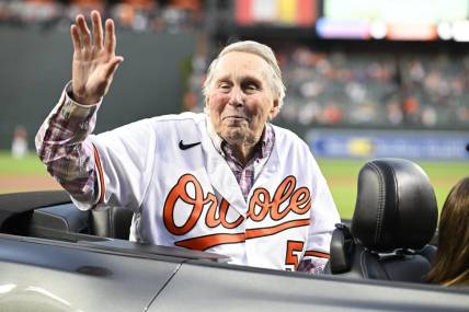 Sep 24, 2022; Baltimore, Maryland, USA; Hall of Fame member and former Baltimore Orioles player Brooks Robinson waves to the crowd prior to a game between the Orioles and the Houston Astros  at Oriole Park at Camden Yards. Mandatory Credit: James A. Pittman-USA TODAY Sports