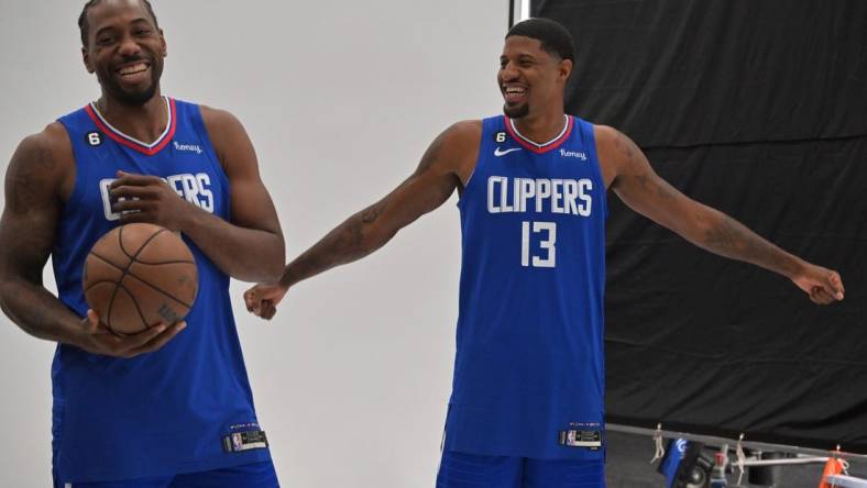 Los Angeles Clippers forward Kawhi Leonard (2) and Los Angeles Clippers guard Paul George (13) are photographed on media day at The Honey Training Center in Playa Vista, CA. Mandatory Credit: Jayne Kamin-Oncea-USA TODAY Sports