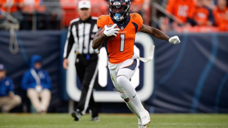 Oct 23, 2022; Denver, Colorado, USA; Denver Broncos wide receiver KJ Hamler (1) runs the ball in the third quarter against the New York Jets at Empower Field at Mile High. Mandatory Credit: Isaiah J. Downing-USA TODAY Sports