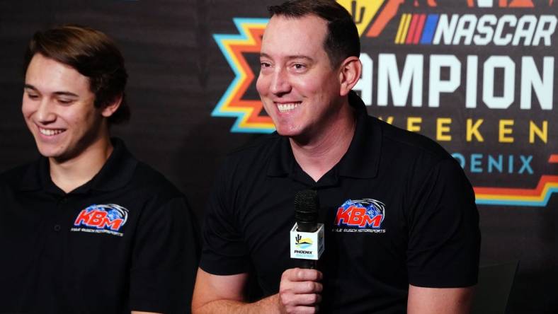 Nov 4, 2022; Avondale, Arizona, USA; Kyle Busch alongside Chase Purdy addresses the media about Kyle Busch Motorsports 2023 NASCAR Craftsman Truck Series lineup and drivers during a press conference at Phoenix Raceway. Mandatory Credit: John David Mercer-USA TODAY Sports