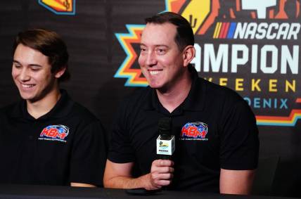 Nov 4, 2022; Avondale, Arizona, USA; Kyle Busch alongside Chase Purdy addresses the media about Kyle Busch Motorsports 2023 NASCAR Craftsman Truck Series lineup and drivers during a press conference at Phoenix Raceway. Mandatory Credit: John David Mercer-USA TODAY Sports