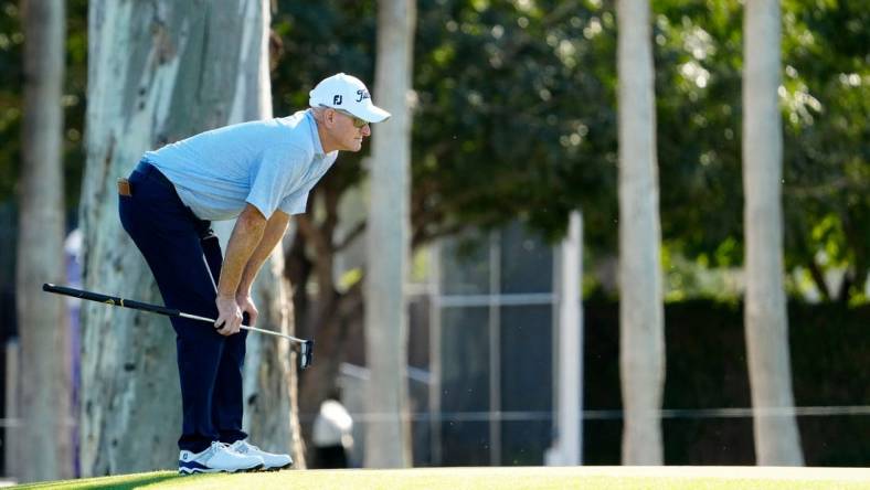 Steve Flesch looks over his putt on the ninth hole during round one of the Charles Schwab Cup at Phoenix Country Club. Mandatory Credit: Rob Schumacher-USA TODAY Sports