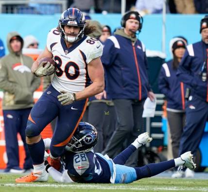 Denver Broncos tight end Greg Dulcich (80) is tackled by Tennessee Titans safety Joshua Kalu (28) during the fourth quarter at Nissan Stadium Sunday, Nov. 13, 2022, in Nashville, Tenn.

Nfl Denver Broncos At Tennessee Titans