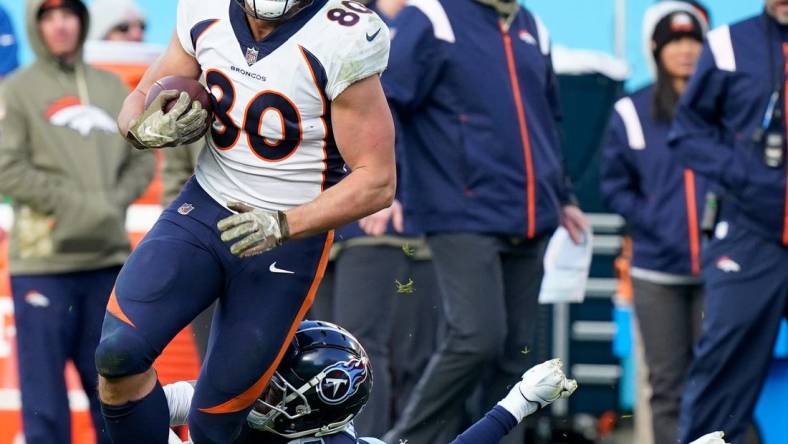 Denver Broncos tight end Greg Dulcich (80) is tackled by Tennessee Titans safety Joshua Kalu (28) during the fourth quarter at Nissan Stadium Sunday, Nov. 13, 2022, in Nashville, Tenn.

Nfl Denver Broncos At Tennessee Titans