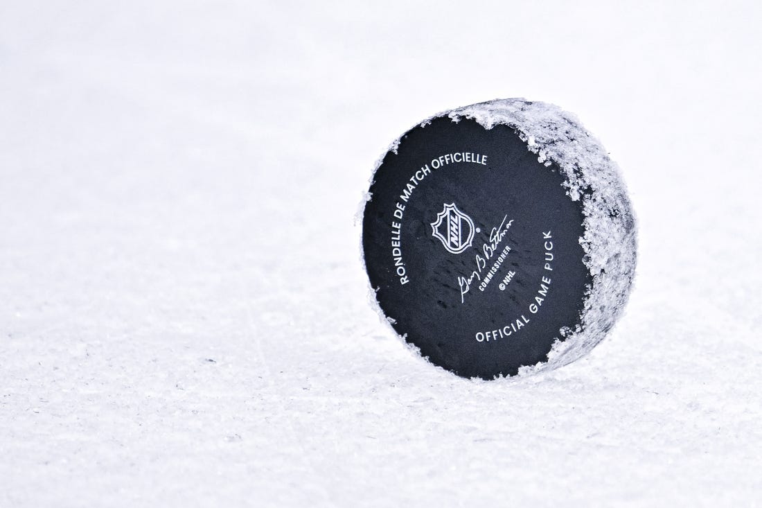 Oct 27, 2022; Dallas, Texas, USA; A general view of an NHL hockey puck during the game between the Dallas Stars and the Washington Capitals at the American Airlines Center. Mandatory Credit: Jerome Miron-USA TODAY Sports