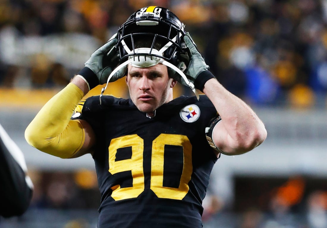 Nov 20, 2022; Pittsburgh, Pennsylvania, USA;  Pittsburgh Steelers linebacker T.J. Watt (90) puts his helmet on before play begins against the Cincinnati Bengals during the fourth quarter at Acrisure Stadium. Mandatory Credit: Charles LeClaire-USA TODAY Sports